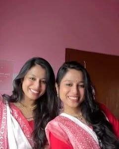 Two friends in red-and-white sarees wearing Jewel by Divi pieces